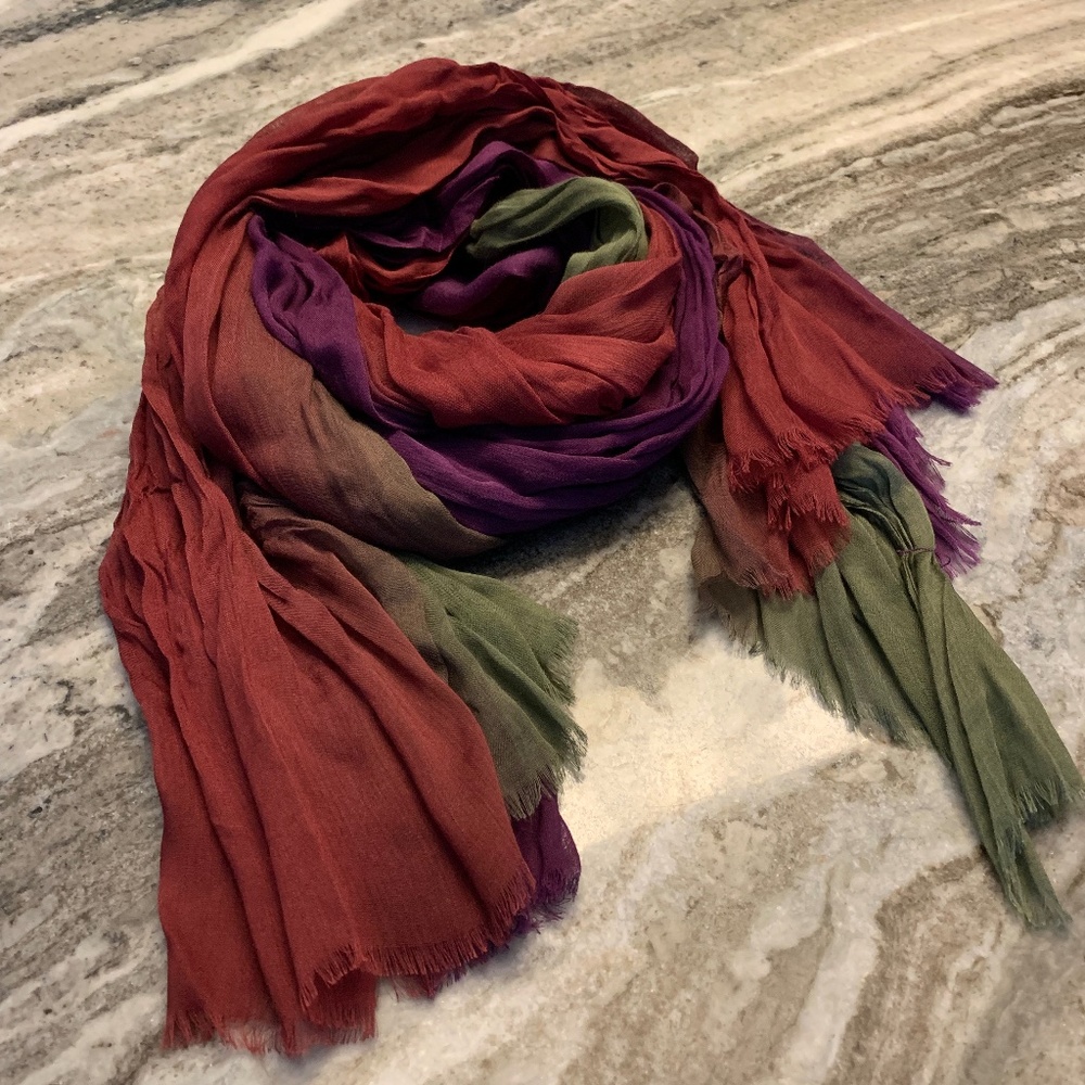 Colorful died long scarf is in shades of purple, red and green. NWT